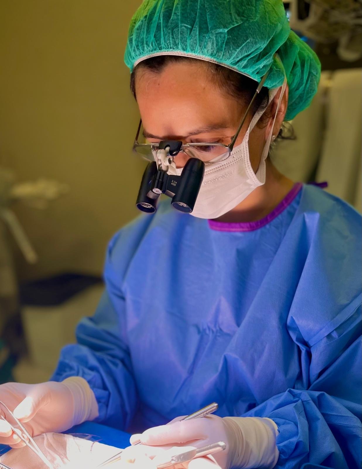 Dr Begoña Etcheverry using surgical loupes during urogenital reconstructive surgery